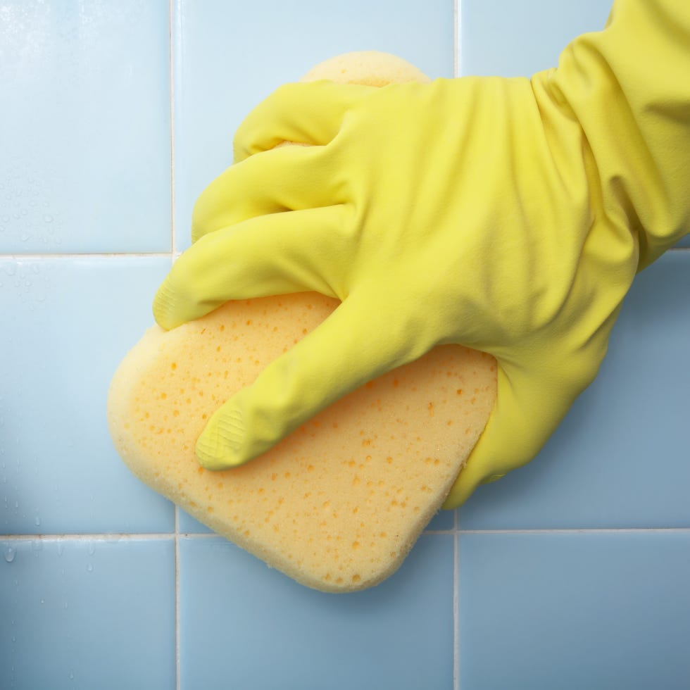 cleaning house scrubbing tile