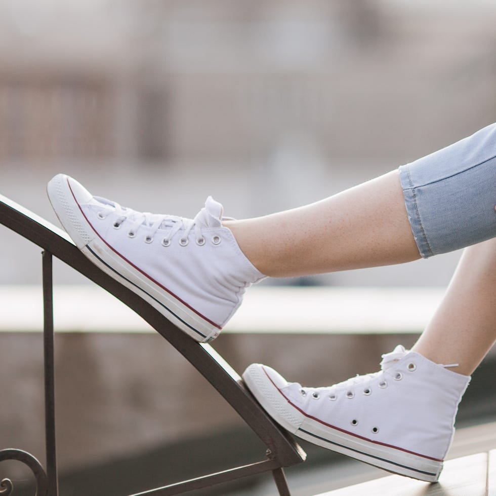 how to clean white shoes, close up of a person wearing white shoes