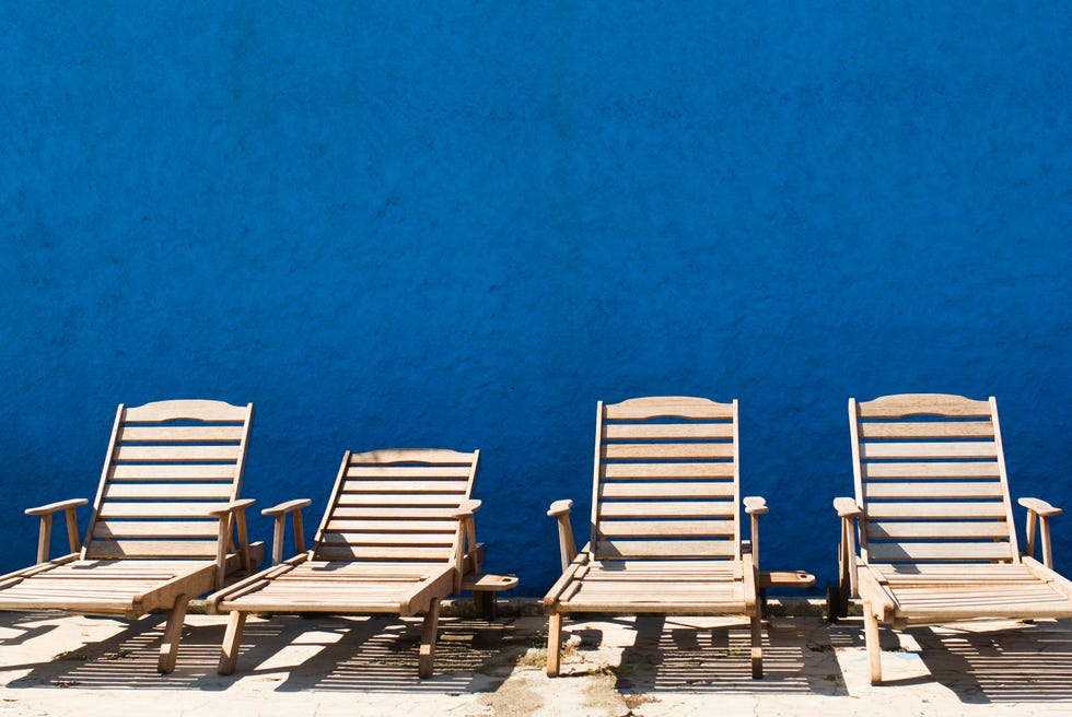 sun patio with four deck chairs