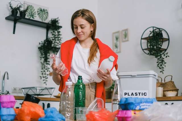 a woman decluttering kitchen before the renovation