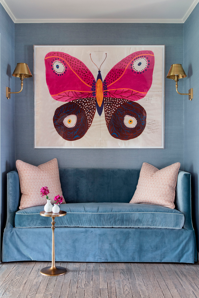 sofa nook in entryway with butterfly painting