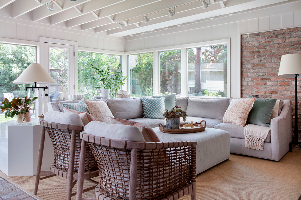 outdoor living space with large sectional and windows